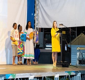 Deputy Director  UNFPA SROC during her speech supported by Youth representatives of Suriname