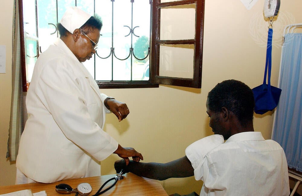 UN Photo - Nurse checks patient