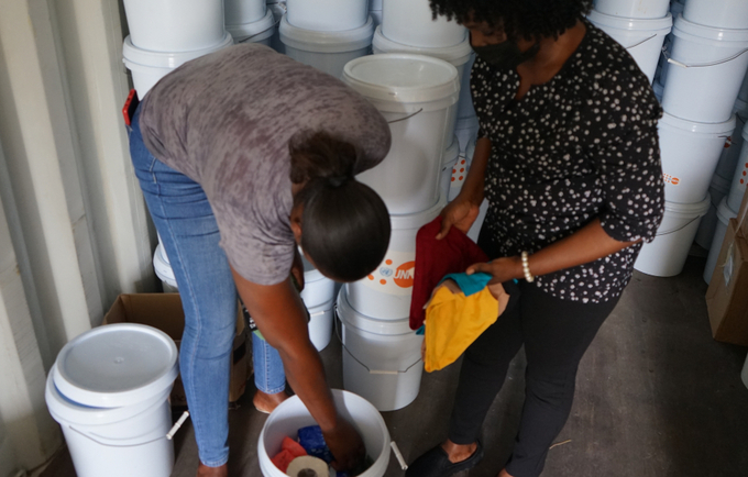 persons preparing dignity kits in light of the 2022 hurricane season