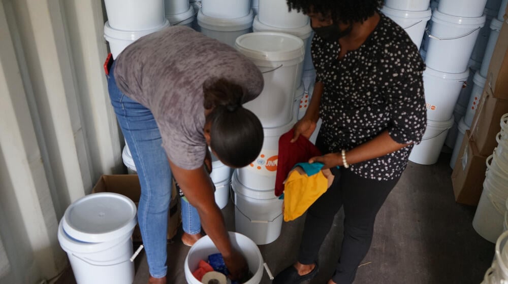 persons preparing dignity kits in light of the 2022 hurricane season