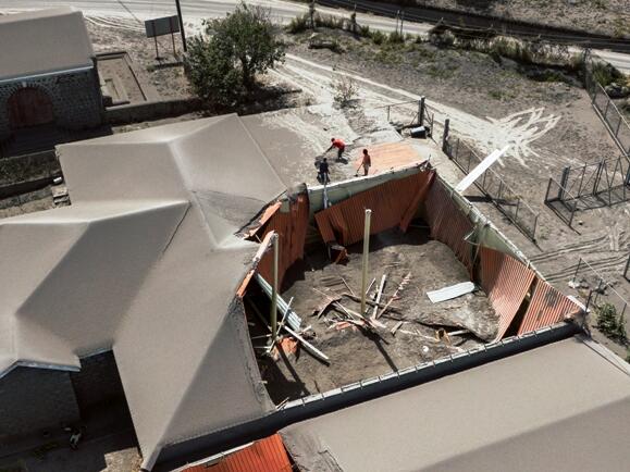 Picture of a collapsed roof caused by the deposition of volcanic ash following the eruption of the LA Soufriere volcano in St. Vincent and the Grenadines