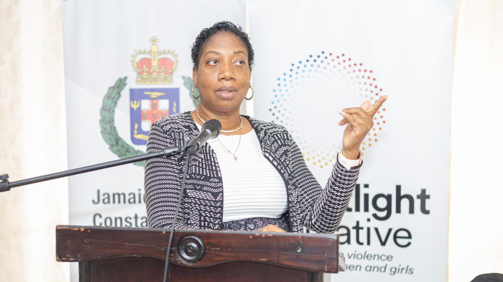 woman at podium delivering speech