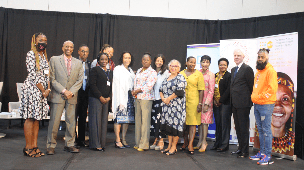 Group photo of representatives standing and smiling